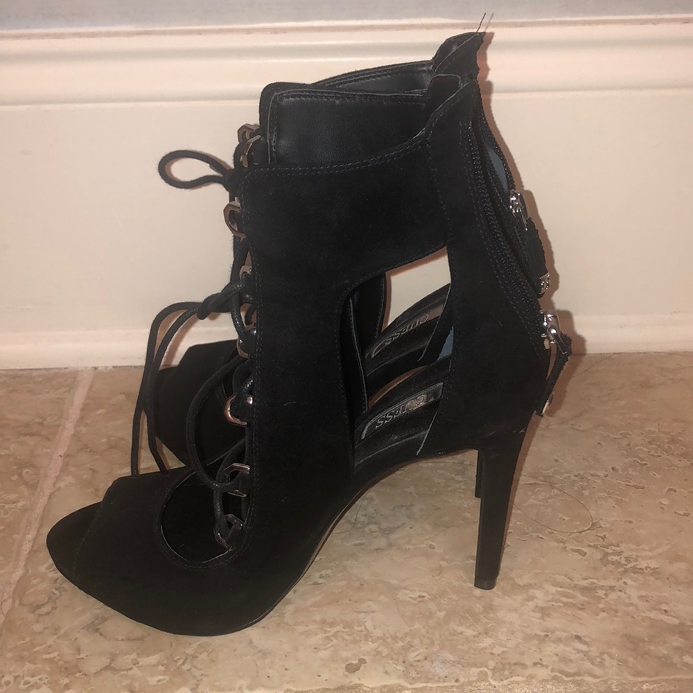 Black Guess size 6.5 with a 4 inch heel
